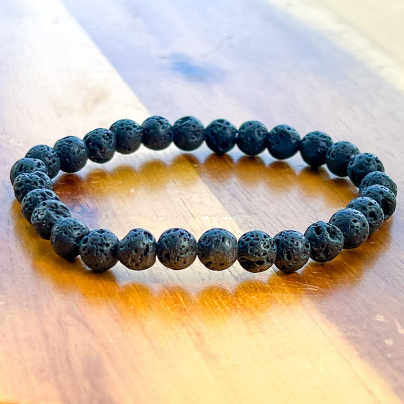Looking for Natural Lava Stone Beaded Bracelet? Shop for Lava Jewelry at Magic crystals. Lava Stone Bracelet Bracelet made of natural gemstones and Lava stones for Oils Diffuser. Wrist Size: 7"-7.5" inches. Protection, Root chakra, Stabilizing and grounding. FREE SHIPPING available.