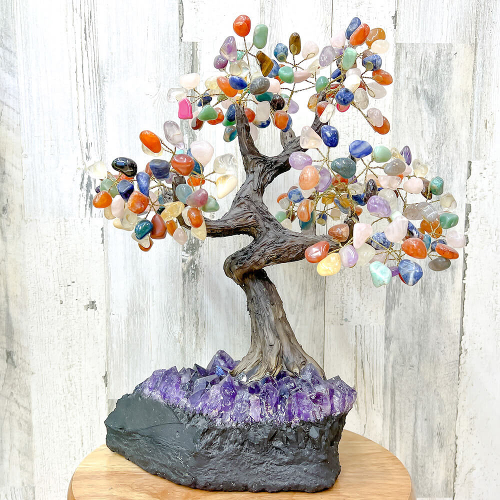 Looking for a large gemstone tree? Shop at Magic Crystals for a 17" - LARGE Multi Gemstone Tree on Amethyst Base with Authentic Crystals. Handmade Gemstone Tree w/Amethyst base. Druzy Amethyst Base. Materials Carnelian, Sodalite, Red Agate, Citrine, Green aventurine, Amethyst, Clear quartz, Rose Quartz and more.