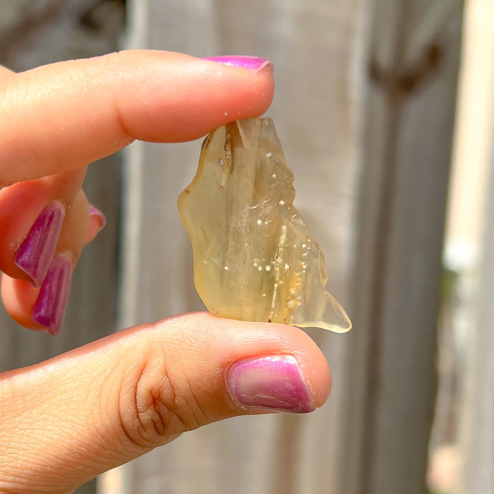 Looking for authentic real Libyan Desert Glass? Shop at Magic Crystals for Lybian Tektite unique pieces by the gram. Yellow and gold tektite from Libya and Egypt. FREE SHIPPING available. Libyan Desert Glass will range between 5-30 mm depending on weight. Rare Tektite at MagicCrystals.com