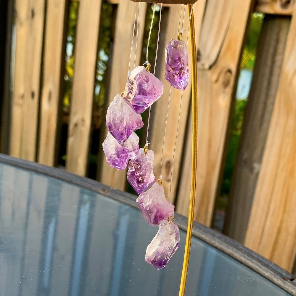 This beautiful 7 crystal point desk chime is made with genuine amethyst crystals draping from a wooden ring. Amethyst Points Desk Chime - Amethyst Home Decor at Magic Crystals with FREE SHIPPING available. perfect for office decor, crystal wind chime, crystal decor. Chime Mobile, Wind Catcher, Spiritual Art.