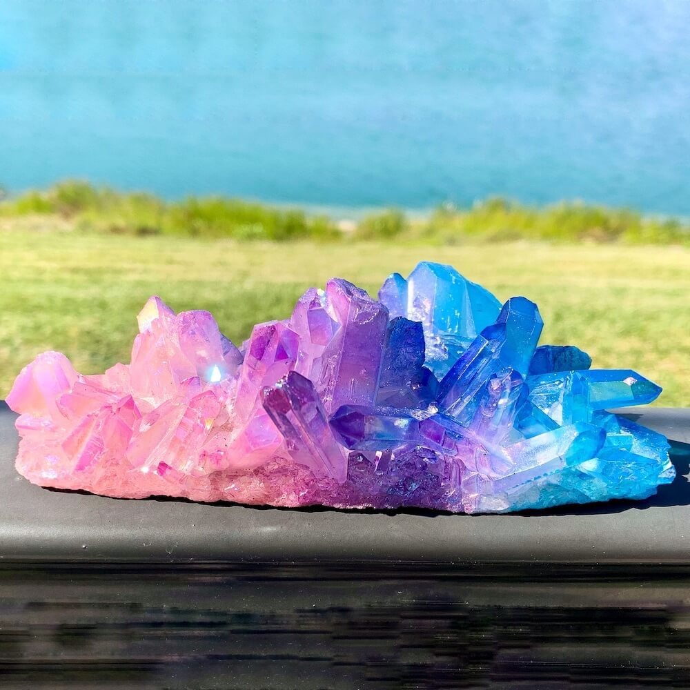 Shop for Aura Quartz cluster points. Blue Purple Aura Crystal Point Aura Stone Flashy Rainbow Aura Crystal Point at Magic Crystals. Blue Aqua Aura & Rose Aura Quartz Cluster 346 grams at magiccrystals.com are Clear Quartz bonded with Platinum which results in a lovely raspberry rose, blue, and a purple metallic sheen.