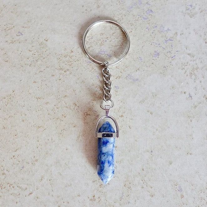 Blue Spot Jasper keychain. Shop at Magic Crystals for Crystal Keychain, Pet Collar Charm, Bag Accessory, natural stone, crystal on the go, keychain charm, gift for her and him. Blue Spot Jasper is for calmness. Blue Spot Jasper Natural Stone Keychain, Crystal Keychain, Blue Spot Jasper Crystal Key Holder. Blue gemstone