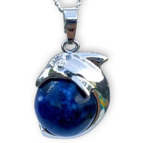 BlueSodalite-Sphere-Dolphin-Pendant-Necklace. Dolphin Necklace - Elegant Ocean-Themed Jewelry for Women Dolphin Charm Necklace at Magic Crystals. Boho Style Jewelry with Natural Gemstones. Stone Carved Dolphin Necklace Pendant, Beach Surf Ocean Boho Gemstone Whale Fairtrade Gift. These beautiful stone necklaces are all hand carved.