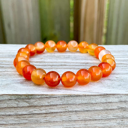 Looking for Natural Carnelian Gemstone Beaded Bracelet? Shop at Magic Crystals for Carnelian Jewelry. CARNELIAN STONE BEAD BRACELET helps with LEADERSHIP and COURAGE. FREE SHIPPING available. Carnelian Beaded 6mm and 8mm stone elastic unisex bracelets. Shop online or in our local store in Miami.