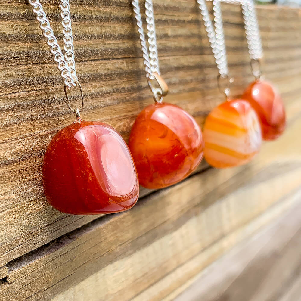 Buy Orange Tumbled Carnelian Necklace - Carnelian Gemstone Jewelry, Natural Carnelian Gemstone Polished Gemstone Points at Magic Crystals. Shop for carnelian jewelry with FREE SHIPPING. Carnelian is best for Motivation. polished Carnelian red and orange stone necklace. Wire-wrapped Carnelian Stone Necklace.