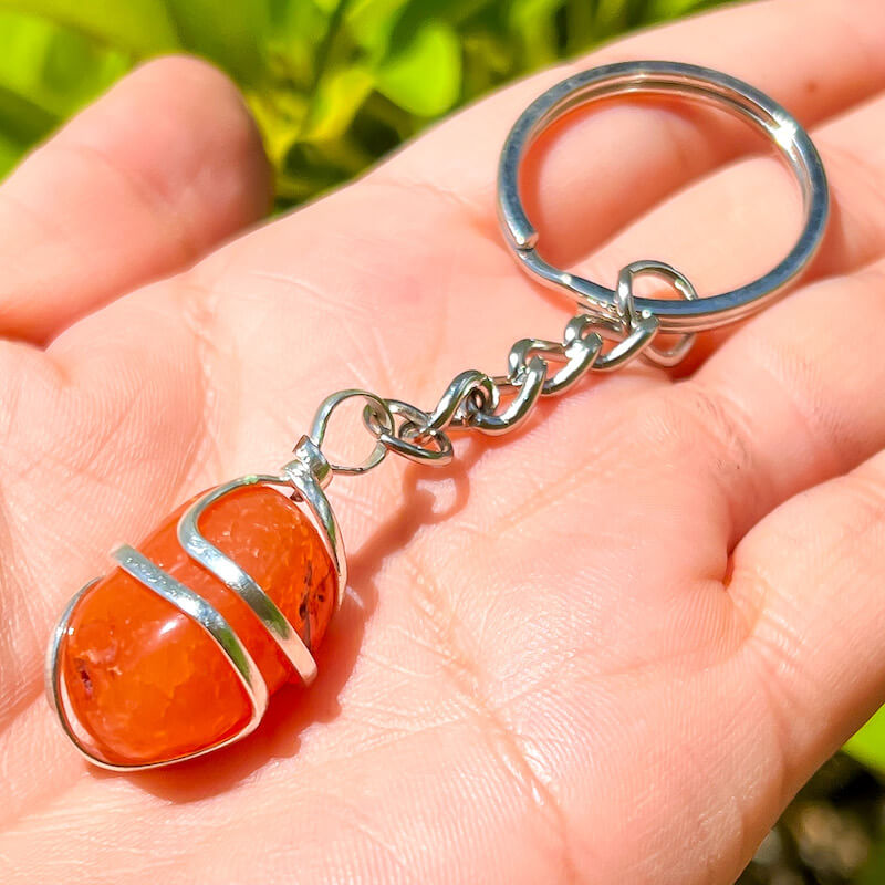Tumbled Stone wrapped Carnelian Keychain. Carnelian keychain. Shop at Magic Crystals for Crystal Keychain, Pet Collar Charm, Bag Accessory, natural stone, crystal on the go, keychain charm, gift for her and him. Carnelian is a great for courage. Carnelian Natural Stone Keychain, Crystal Keychain, Carnelian Crystal Key Holder. Yellow gemstone.