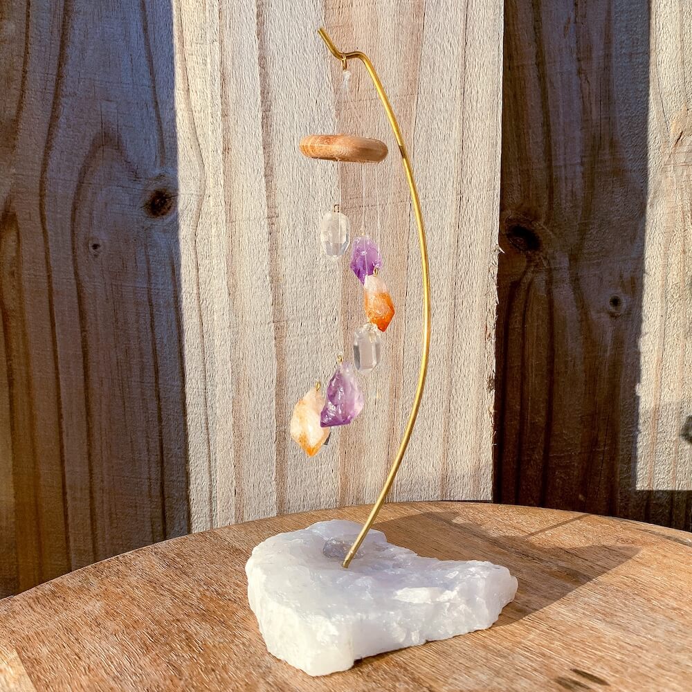 This beautiful 7 crystal point desk chime is made with genuine Clear Quartz, Amethyst, and Citrine crystals draping from a wooden ring. Desk Chime Home Decor at Magic Crystals with FREE SHIPPING available. perfect for office decor, crystal wind chime, crystal decor. Chime Mobile, Wind Catcher, Spiritual Art.
