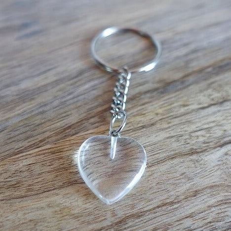 Clear Crystal Quartz keychain. Shop at Magic Crystals for Crystal Keychain, Pet Collar Charm, Bag Accessory, natural stone, crystal on the go, keychain charm, gift for her and him. Clear Crystal Quartz is a great for all hear. Clear Crystal Quartz Natural Stone Keychain, Crystal Keychain, Clear Crystal Quartz Crystal Key Holder. White clear gemstone.