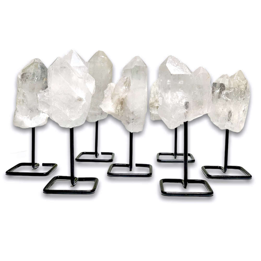 Shop from MagicCrystals.Com One RoughDruzy Clear Quartz Metal Stand, Clear Quartz Chunk on Stand, Point on Stand Pin, Clear Quartz Protect Stone, Rough Clear Quartz, Raw Clear Quartz! We carry a wide variety of clear quartz gemstones and quartz specimens. FREE SHIPPING AVAILABLE.