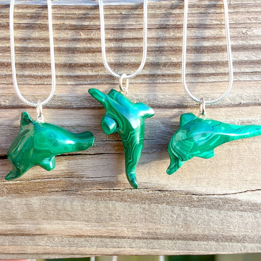 Malachite Dolphin Pendant Necklace - Malachite Jewelry at Magic Crystals. Malachite stimulates the heart chakra. Makes a perfect Valentine's day gift or Christmas Present. Malachite is ideal for burning through the fog of emotional confusion. Heart chakra stones - heart chakra crystals - malachite jewelry