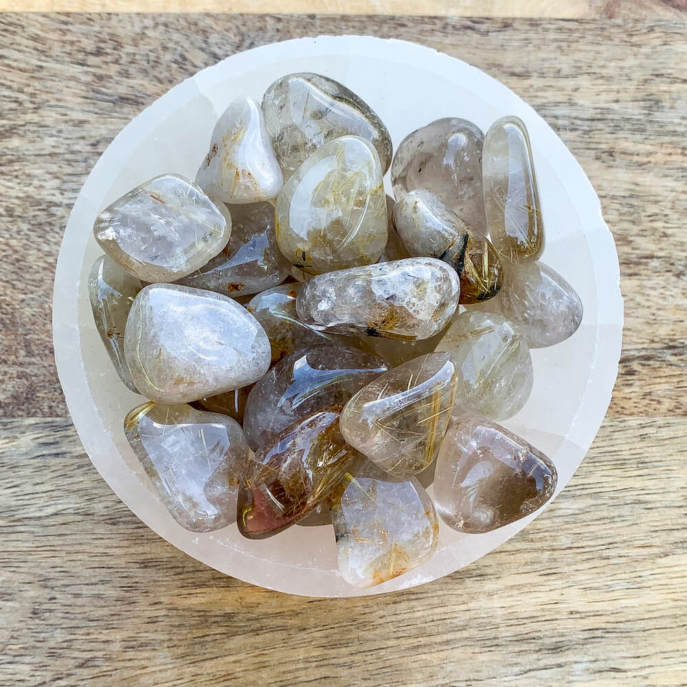 Buy Gold Rutilated Quartz Tumbled Stone - Gold Rutile crystals - Choose how many stones, Singles, or Bulk at Magic Crystals. FREE SHIPPING Crystal Gift, Gift, Gift for Friends, Gift for sister, Gift for Crystals Lovers at Magic Crystals. Golden rutile Quartz is known to aid in clarity, well-being, and willpower.