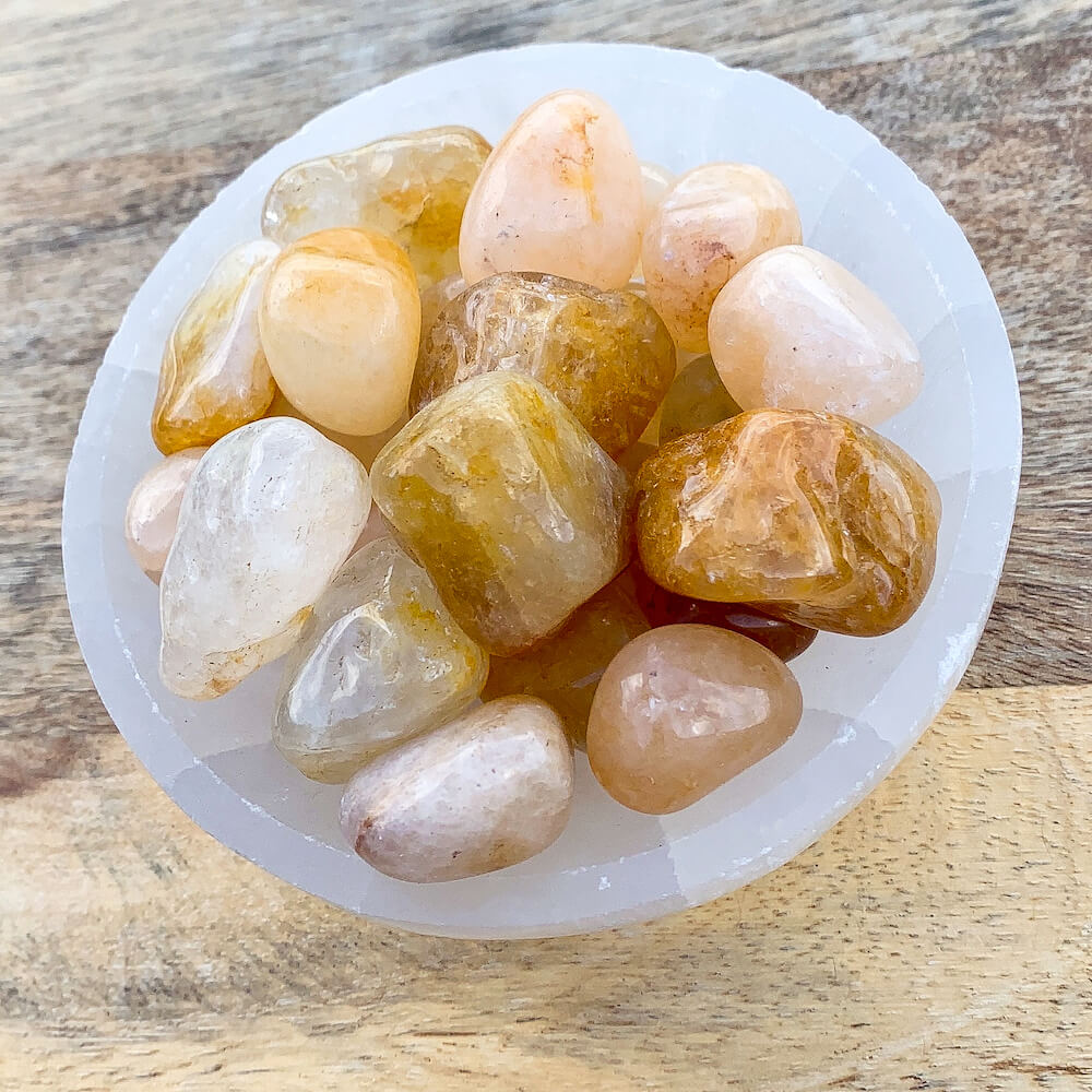 Buy Golden Healer Quartz Tumbled Stones | Golden Healer Quartz Polished Gemstones, Bulk Crystals at Magic Crystals. Golden Healer Quartz, known as A "Master Healer". Powerful for connecting with source energy. Connects the solar plexus chakra up to the Crown Chakra.