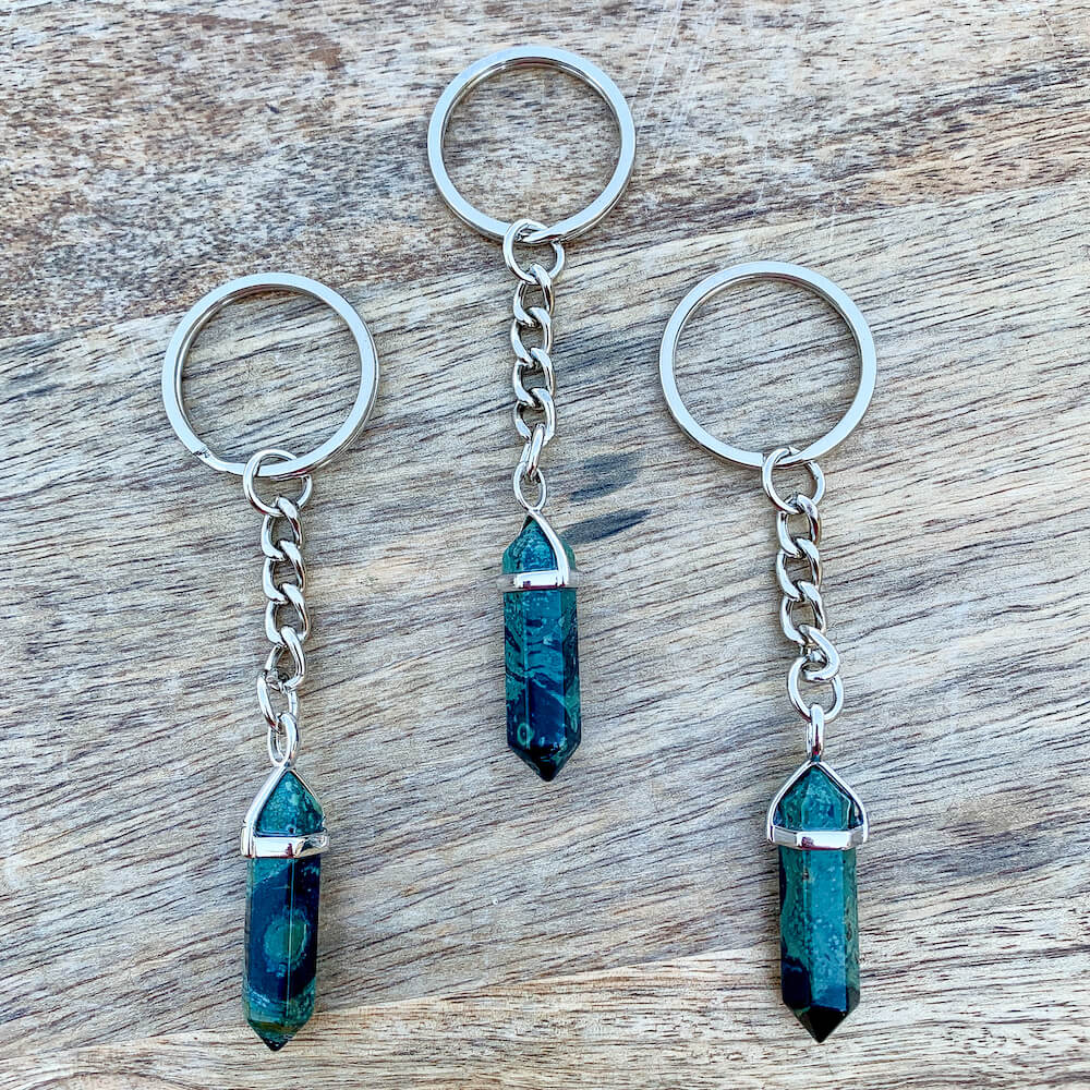 Looking for a Kambaba Jasper stone? Find the best Rhyolite Kambaba Jasper Stone Double Point Handmade keychain when you shop at Magic Crystals. Kambaba Jasper crystal jewelry, Rhyolite, Kambaba Jasper meaning stone of peace, tranquility, and fertility. Crocodile jasper properties, jasper healing properties.