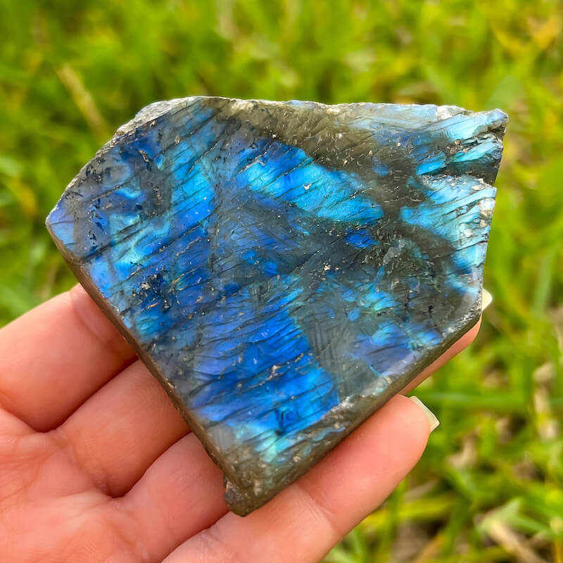 Looking for polished labradorite? Shop at Magic Crystals for Labradorite Stone Slab - Free Form Labradorite. Empathetic, supporting, and glowing with soft, pretty color, this Labradorite palm stone is a wonderful crystal gift for someone you love.