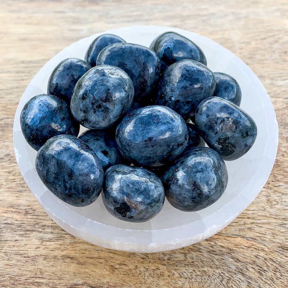 Looking for Larvikite Tumbled Stone - Black Labradorite? Shop Labradorite Black Labradorite at Magic Crystals. Gray polished stones, gray Gemstones, for Healing, meditation, protection, and grounding. Connect with nature spirits. FREE SHIPPING AVAILABLE.