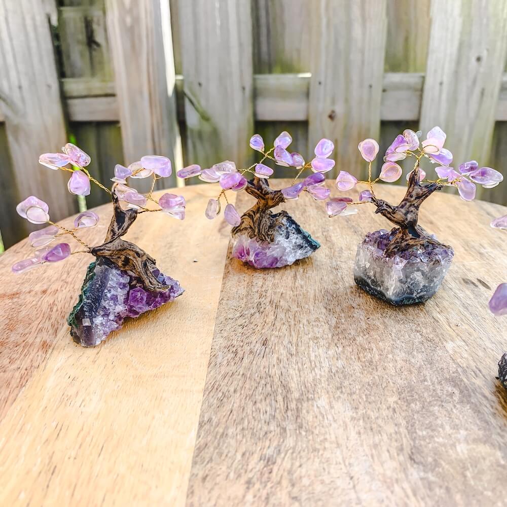 Looking for crystal home decor? Shop at Magiccrystals.com for Mini Purple Amethyst Bonsai Tree on Amethyst Cluster. Magic Crystals has a variety of HOME DECOR made of crystals and gemstones. Amethyst is a powerful and protective stone. Gemstone tree. Birthstone tree sculpture. Amethyst geode gift. FREE SHIPPING