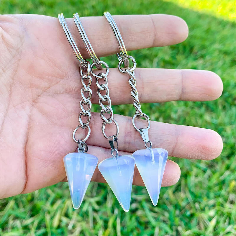 Opalite-Point-Keychain. Opalite KEYCHAIN. Shop at Magic Crystals for Crystal Keychain, Pet Collar Charm, Bag Accessory, natural stone, crystal on the go, keychain charm, gift for her and him. Opalite is a great SPIRITUALITY. FREE SHIPPING available. Opalite Crystal Key Chain, Crystal Keyring, Opalite Crystal Key Holder. Purple stone keys