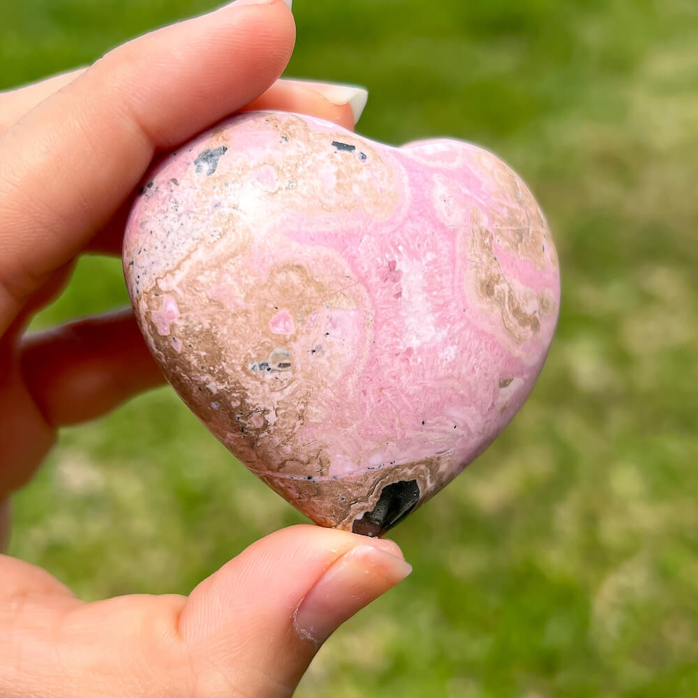 Shop for handmade Pink Rhodonite heart - Peruvian Rhodonite Carved Heart at Magic Crystals. Rhodonite Polished Heart Healing Crystal Gemstone. Rhodonite is a wonderfully peaceful crystal. Enjoy FREE SHIPPING when you shop at magiccrystals.com