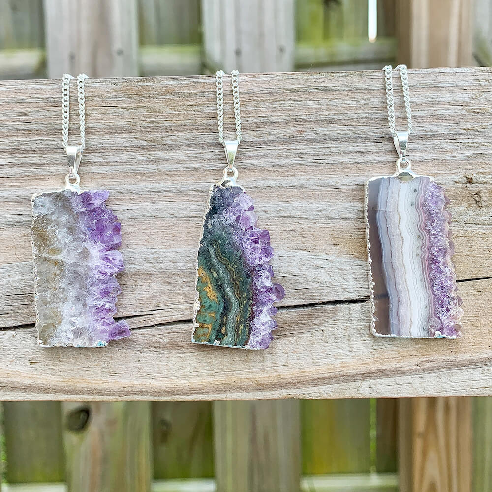 Looking for Raw Amethyst Silver Plated Handmade Pendant Necklace? Shop at Magic Crystals for Amethyst Jewelry. Amethyst Stone necklaces are good for PROTECTION, PURIFICATION, and SPIRITUALITY. Raw Amethyst Slice Pendant February Birthstone Necklace Gold Filled Chain Rectangle. Purple Crystal Gift. Handmade Jewelry.