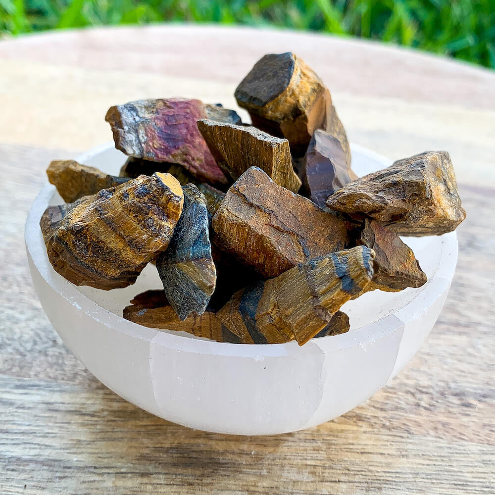 Looking for Raw Yellow Tiger Eye Stone? Shop at Magic Crystals for Tiger Eye TUMBLED from Africa. Rough Tiger Eye also known as a Third Eye, Sacral Chakra gemstone is wonderful for balance, energy healing, and reiki. Tigers Eye Jewelry, Stones, bracelets, necklaces, and more with FREE SHIPPING available.