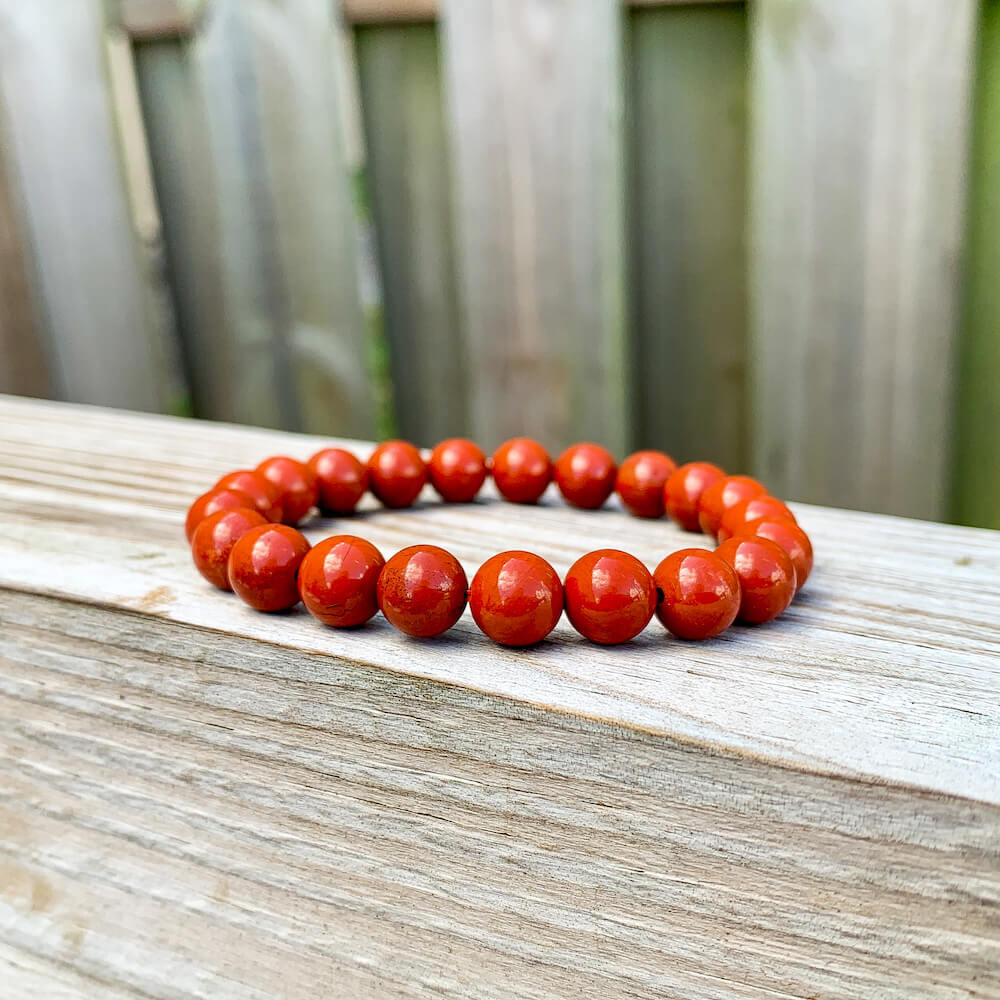 Looking for Red Jasper Jewelry? Shop at Magic Crystals for Red Jasper Beaded Bracelets. Natural Red Jasper Unisex Elastic Bracelet. Red jasper is a stone of physical strength, a vitality that can help with the stabilization of one’s energy. FREE SHIPPING available. Natural Healing Gemstone Buddha Charm Bracelet, red jasper earrings, and rings.