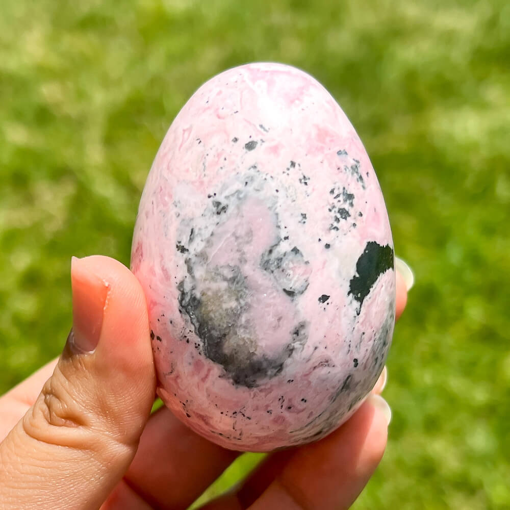 Shop for handmade Pink Rhodonite Egg - Peruvian Rhodonite Carved Egg at Magic Crystals. Rhodonite Polished Egg Healing Crystal Gemstone. Rhodonite is a wonderfully peaceful crystal. Enjoy FREE SHIPPING when you shop at magiccrystals.com. Undrilled crystal egg. Undrilled Pink Egg.