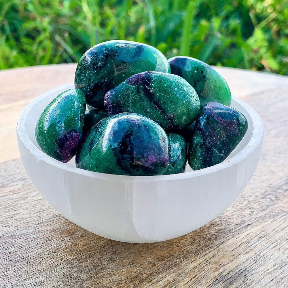 Looking for Ruby Fuchsite Crystal - ruby stone - ruby tumbled stone healing crystals and stones - heart chakra stone? Shop at MAGIC CRYSTALS. Ruby Fuchsite tumbled stone. Ruby initiates the pleasures of life and stimulates the heart, encouraging one to enjoy being in the physical world. FREE SHIPPING AVAILABLE.