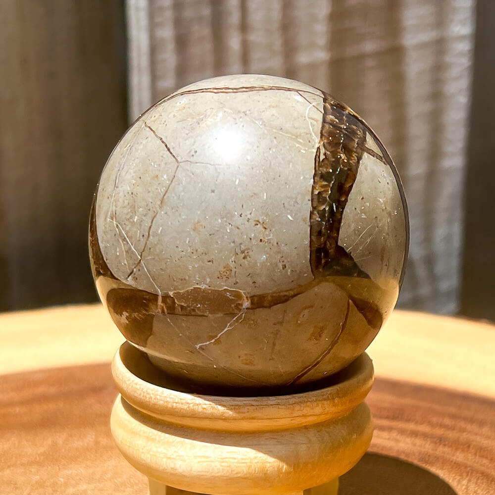 Looking for Septarian Dragon Stone Sphere? Shop for Septarian Dragon Stone Sphere - A, Septarian Dragon Stone Sphere, Septarian Nodule Crystal Ball at Magic Crystals. UV Reactive Septarian Stone, Grounding Minerals. Septarian stone has a calming, nurturing energy, and can bring feelings of joy and spiritually uplifting