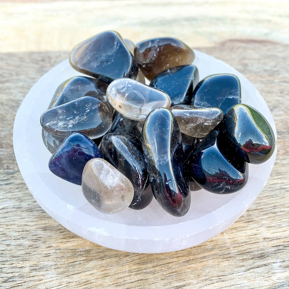 Buy Smokey Quartz Tumbled Stones, Smokey Quartz Polished Gemstones, Polished Gray Stone, Bulk Crystals at Magic Crystals. Smokey Quartz helps anyone get the grounding they need to make the logical choices that will achieve their goals. FREE SHIPPING available.