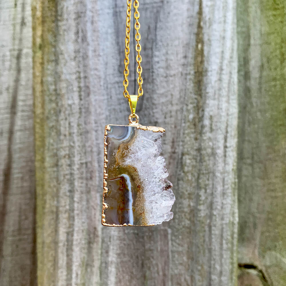 Looking for Raw Amethyst Gold Plated Handmade Pendant Necklace? Shop at Magic Crystals for Amethyst Jewelry. Amethyst Stone necklaces are good for PROTECTION, PURIFICATION, and SPIRITUALITY. Raw Amethyst Slice Pendant February Birthstone Necklace Gold Filled Chain Rectangle. Purple Crystal Gift. Handmade Jewelry.