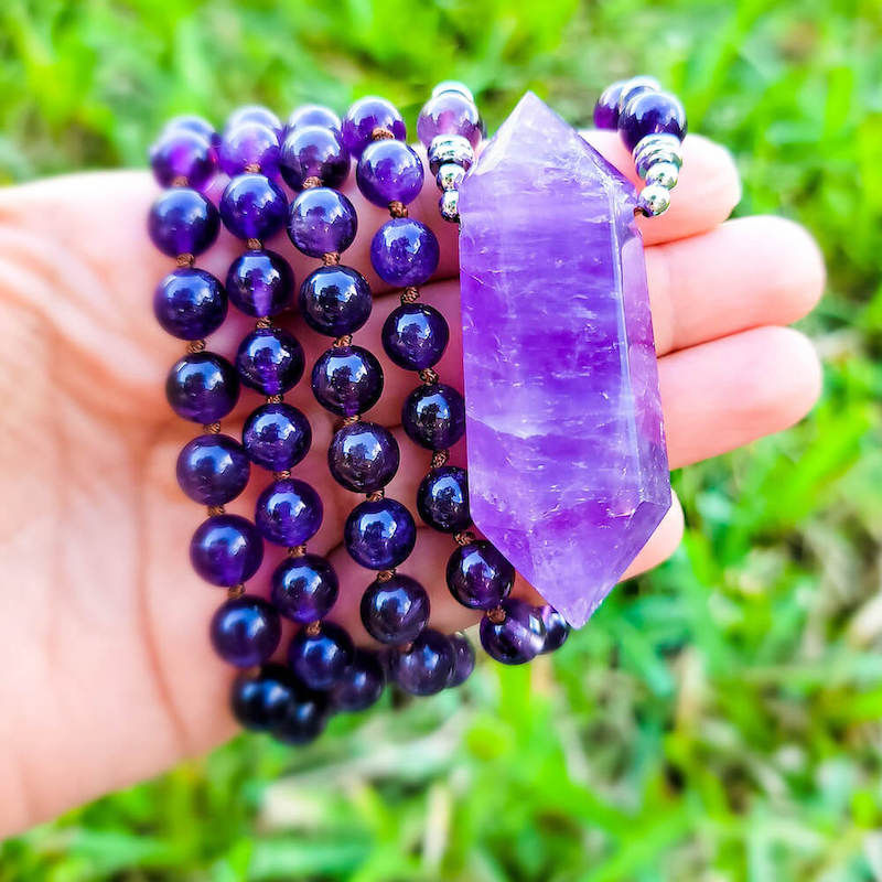 Shop beautiful hand crafted Amethyst Mala Necklace. High quality Prayer Beads Necklace at Magic Crystals. Magiccrystals.com Inspiring People To Practice Yoga and Meditation. Check out our Mala Necklaces Collection. Mala beads are a string of beads that are used in a meditation practice.