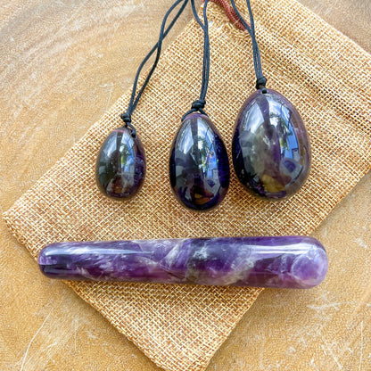 Amethyst-Yoni Eggs Set and Massage Wand. These Natural Stone Yoni Egg Set and Massage Wand from Magic Crystals help you build an intimate connection with your body. Polished yoni egg crystals and wand are drilled available in Black Onyx,  Opalite, Unakite, Nephrite Jade, tiger Eye, Clear Quartz, Red jasper, Aventurine, Amethyst, Rose Quartz