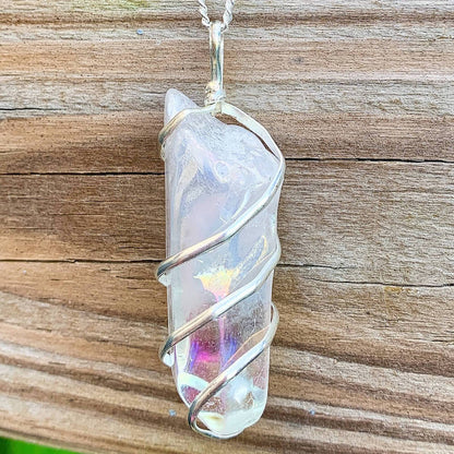 Looking for Point Natural Aura Quartz Jewelry? Magic Crystals carries a variety of Aura Quartz Spiral Wrapped Necklace. Quartz Crystal Point necklace. Wrap Necklace for Men Women. Rose, Angel, Purple, Blue Aqua, Sunshine, Ruby, Rainbow, Sunshine, Green Apple, Deep Blue, Tangerine, Deep Rose Aura Quartz