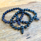 Looking for Black Agate Mala Beads Bracelet? Shop at Magic Crystals for Black Agate Jewelry. Black Agate Stone Bracelets are good for PROTECTION, SUCCESS, and COURAGE. lack Agate is a stone of strength. Natural Gemstone bracelets with Free Shipping available. Black Agate unisex bracelet. 8mm bracelet.