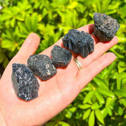 Shop for Black Tourmaline Crystal Chunks -  Rough Tourmaline at Magic Crystals . Black Tourmaline is a perfect mineral to protect your aura. FREE SHIPPING available. Tourmaline Raw stones. Genuine black tourmaline discs, pointers, crystals and stones.