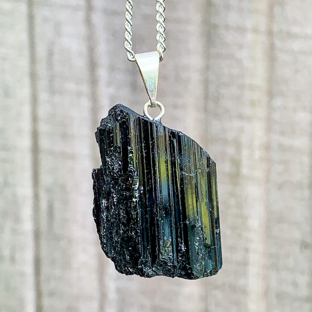 Check out our Raw Black Tourmaline Crystal Pendant Silver Necklace. The Best Quality Handmade Healing Crystal Gemstones for Protection. This is a Great Stone to Keep you grounded and Align your Root Chakra. Black Tourmaline Also Aids in the Removal of Negative Energies Magic Crystal Free Shipping Available.