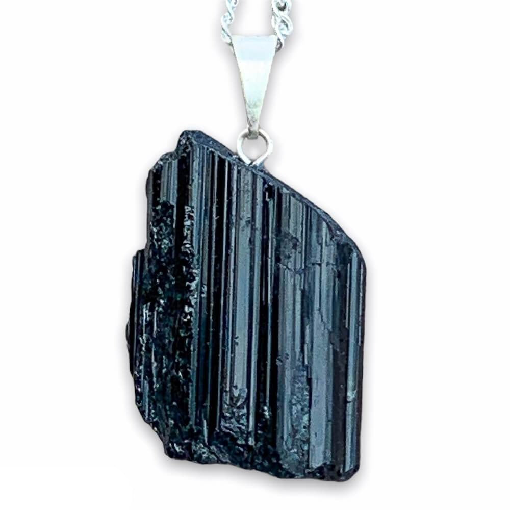 Check out our Raw Black Tourmaline Crystal Pendant Silver Necklace. The Best Quality Handmade Healing Crystal Gemstones for Protection. This is a Great Stone to Keep you grounded and Align your Root Chakra. Black Tourmaline Also Aids in the Removal of Negative Energies Magic Crystal Free Shipping Available.