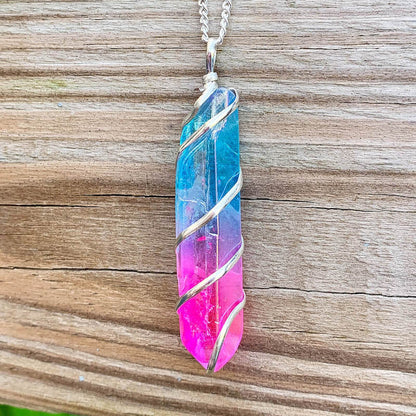 Looking for Point Natural Aura Quartz Jewelry? Magic Crystals carries a variety of Aura Quartz Spiral Wrapped Necklace. Quartz Crystal Point necklace. Wrap Necklace for Men Women. Rose, Angel, Purple, Blue Aqua, Sunshine, Ruby, Rainbow, Sunshine, Green Apple, Deep Blue, Tangerine, Deep Rose Aura Quartz