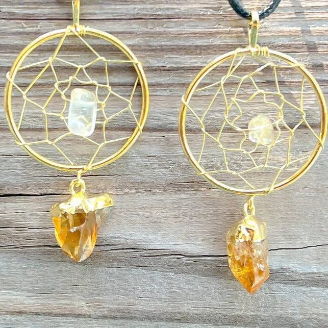 Gorgeous gold plated Citrine Dreamcatcher gold Necklace adorned with a clear quartz crystal bead and a raw Citrine crystal hanging from the bottom. Shop at Magic Crystals for Citrine Jewelry, Healing Crystals, and Stones. Perfect gift for someone or to wear every day. Boho Jewelry, February Birthstone.