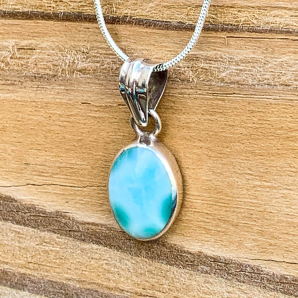 This lovely, rare and spectacular mineral gem called Larimar is found in the Dominican Republic. Shop Genuine Larimar Necklace set in Sterling Silvera at Magic Crystals. We carry Larimar Pendant, Sterling Caribbean Larimar Necklace, Gift For Her, Gemstone Pendant. Magiccrystals.com carries the essence of the ocean.