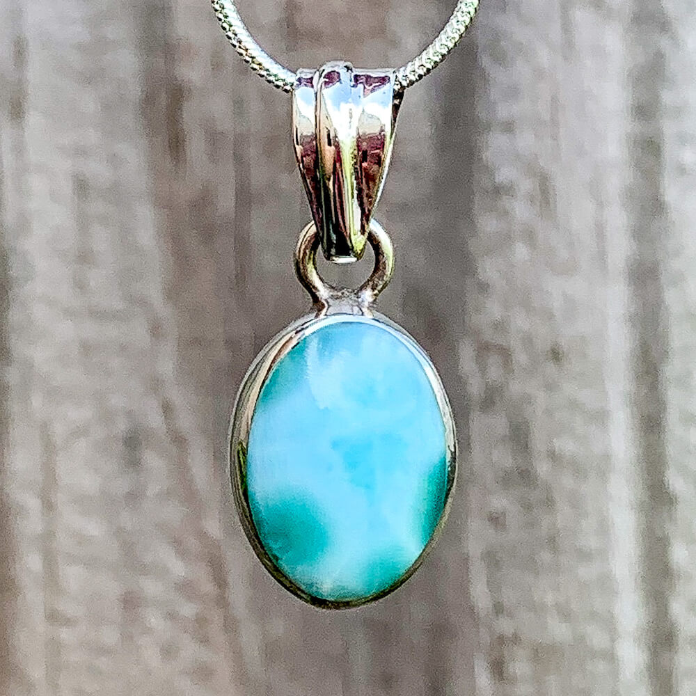 This lovely, rare and spectacular mineral gem called Larimar is found in the Dominican Republic. Shop Genuine Larimar Necklace set in Sterling Silvera at Magic Crystals. We carry Larimar Pendant, Sterling Caribbean Larimar Necklace, Gift For Her, Gemstone Pendant. Magiccrystals.com carries the essence of the ocean.