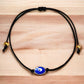 Blue-Evil-Eye-Red-String-Bracelet. Shop at Magic Crystals for Protection. The Red String Bracelet has been worn throughout history in many cultures as a symbol of protection, faith, and good luck and acts as a shield from negativity and actually has many positive effects. In quite a few cultures a red string bracelet is believed to have magical powers.