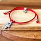 Fatima-Hand-Eye-Red-String-Bracelet. Shop at Magic Crystals for Protection. The Red String Bracelet has been worn throughout history in many cultures as a symbol of protection, faith, and good luck and acts as a shield from negativity and actually has many positive effects. In quite a few cultures a red string bracelet is believed to have magical powers.