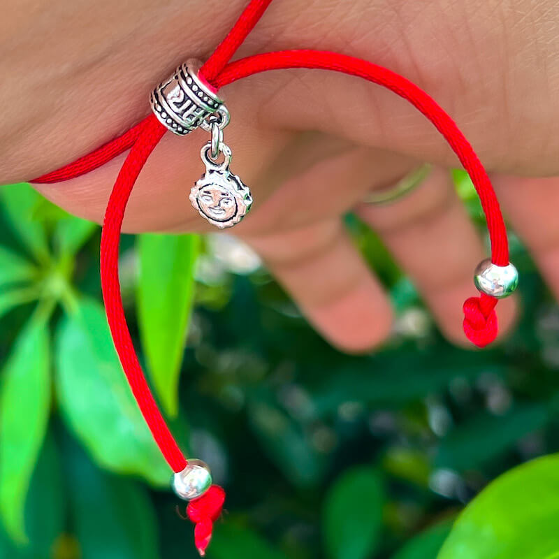    Fatima-Hand-Red-String-Bracelet. Shop at Magic Crystals for Protection. The Red String Bracelet has been worn throughout history in many cultures as a symbol of protection, faith, and good luck and acts as a shield from negativity and actually has many positive effects. In quite a few cultures a red string bracelet is believed to have magical powers.
