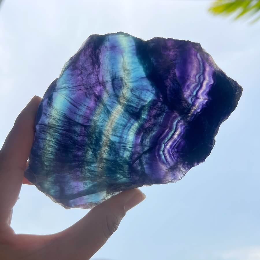 Quality Rainbow Fluorite Slab, Polished Fluorite Crystal, Natural Home Decor from MagicCrystals.com ships from Miami, FL since 2018. Polished fluorite crystal features beautiful bands of natural coloring with lovely depth, clarity, and unique internal patterns throughout the piece. 