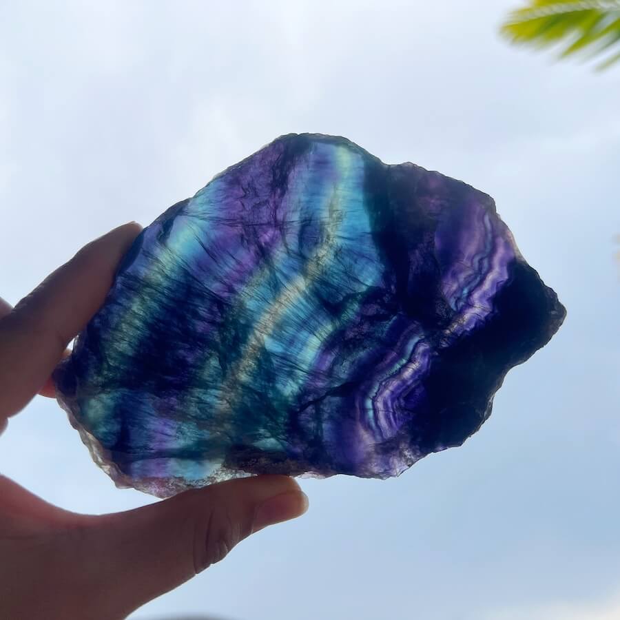 Quality Rainbow Fluorite Slab, Polished Fluorite Crystal, Natural Home Decor from MagicCrystals.com ships from Miami, FL since 2018. Polished fluorite crystal features beautiful bands of natural coloring with lovely depth, clarity, and unique internal patterns throughout the piece. 