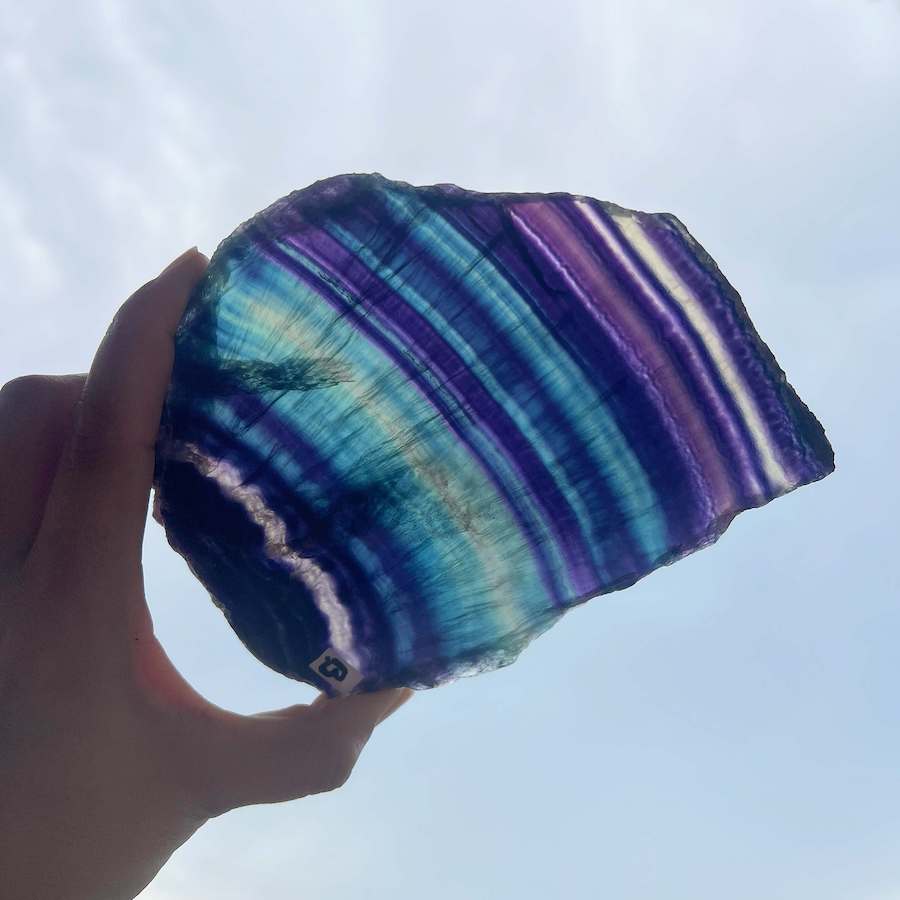 Quality Rainbow Fluorite Slab, Polished Fluorite Crystal, Natural Home Decor from MagicCrystals.com ships from Miami, FL since 2018. Polished fluorite crystal features beautiful bands of natural coloring with lovely depth, clarity, and unique internal patterns throughout the piece. 
