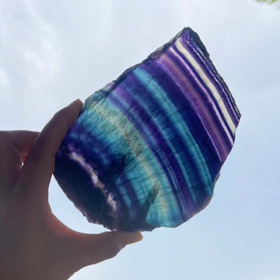 Quality Rainbow Fluorite Slab, Polished Fluorite Crystal, Natural Home Decor from MagicCrystals.com ships from Miami, FL since 2018. Polished fluorite crystal features beautiful bands of natural coloring with lovely depth, clarity, and unique internal patterns throughout the piece. 
