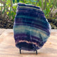 Quality Rainbow Fluorite Slab, Polished Fluorite Crystal, Natural Home Decor from MagicCrystals.com ships from Miami, FL since 2018. Polished fluorite crystal features beautiful bands of natural coloring with lovely depth, clarity, and unique internal patterns throughout the piece. 