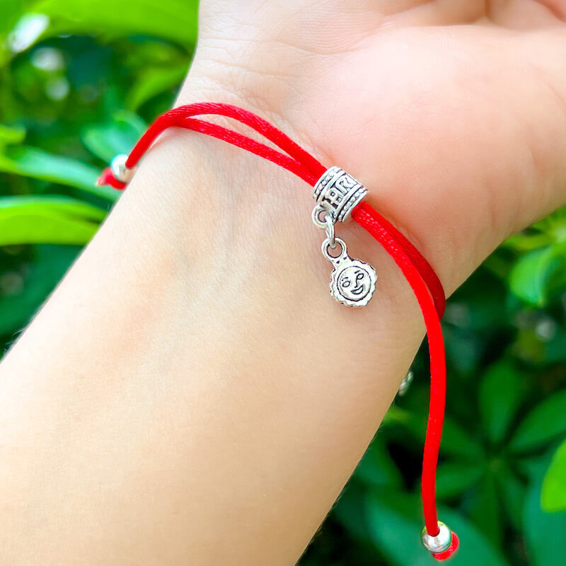 Guardian-Angel-Red-String-Bracelet. Shop at Magic Crystals for Protection. The Red String Bracelet has been worn throughout history in many cultures as a symbol of protection, faith, and good luck and acts as a shield from negativity and actually has many positive effects. In quite a few cultures a red string bracelet is believed to have magical powers.